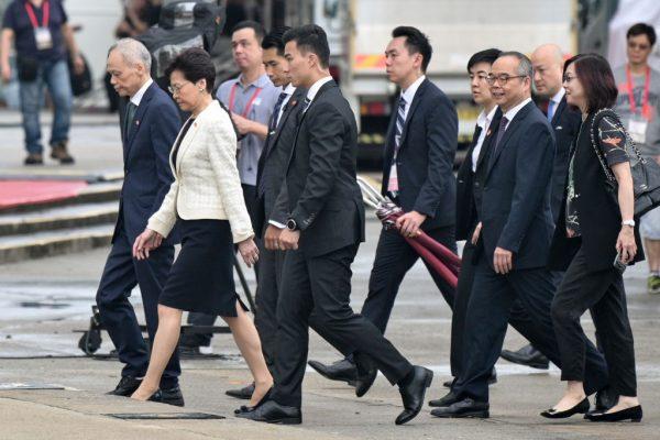 Hong Kong Chief Executive Carrie Lam (front L) attends the annual flag raising ceremony to mark the 22nd anniversary of the city's handover from Britain to China, in Hong Kong on July 1, 2019. (ANTHONY WALLACE/AFP/Getty Images)