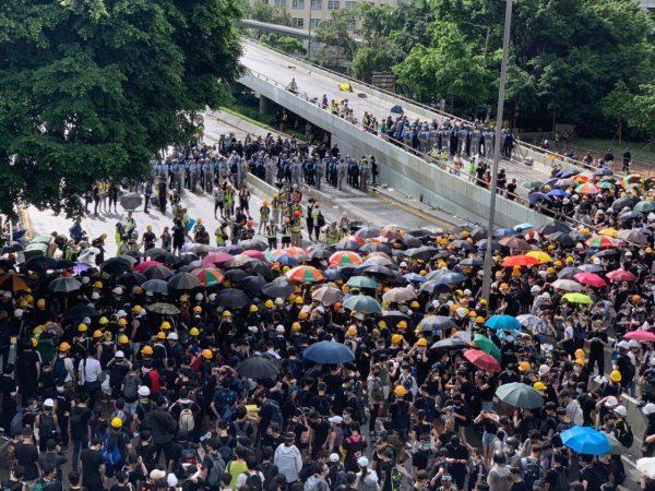Protesters at Harcourt Road, Admiralty, facing Hong Kong police on July 1, 2019. (Li Yi/The Epoch Times)