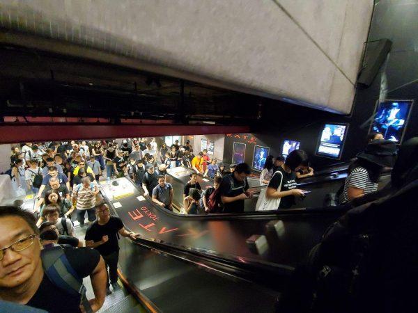 People dressed in black begin to arrive at Causeway Bay metro station in Hong Kong on July 1, 2019. (Sun Qingtian/The Epoch Times)