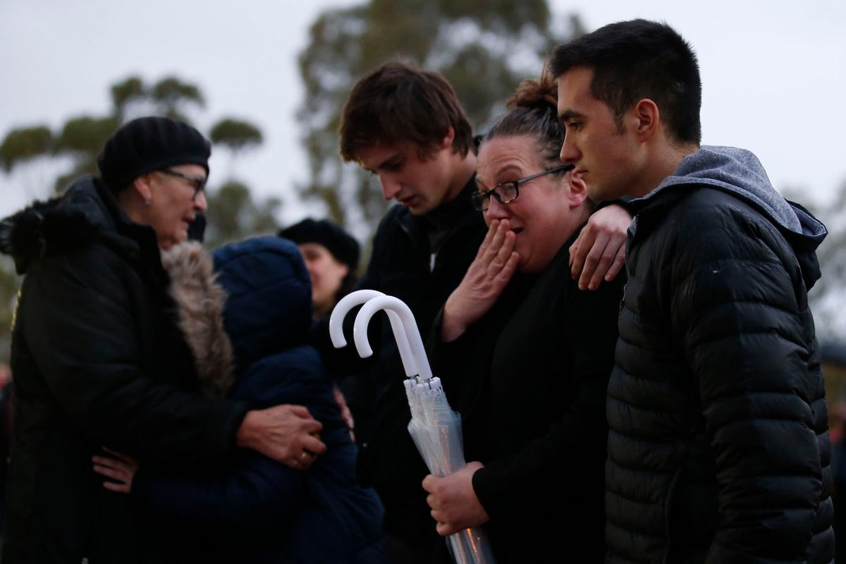 Family members gather at the make shift memorial in Royal Park in Melbourne, Australia, on May 31, 2019. (Darrian Traynor/Getty Images)