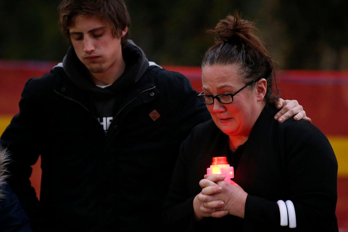 Family members gather at the make shift memorial in Royal Park in Melbourne, Australia on May 31, 2019. (Darrian Traynor/Getty Images)