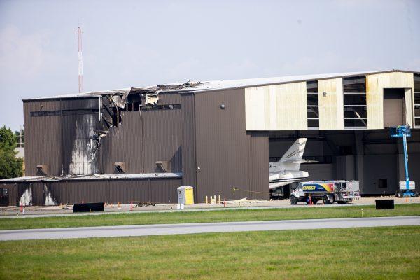 A twin-engine plane crashed into this hangar at Addison Airport in Addison, Texas, on June 30, 2019. (Shaban Athuman/The Dallas Morning News via AP)