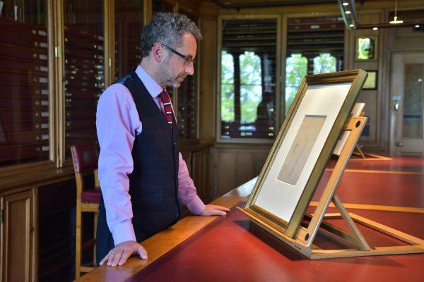 Martin Clayton, head of prints and drawings, at the Royal Collection Trust, studies a sketch of Leonardo in the Print Room at Windsor Castle. (Royal Collection Trust /Her Majesty Queen Elizabeth II 2019)