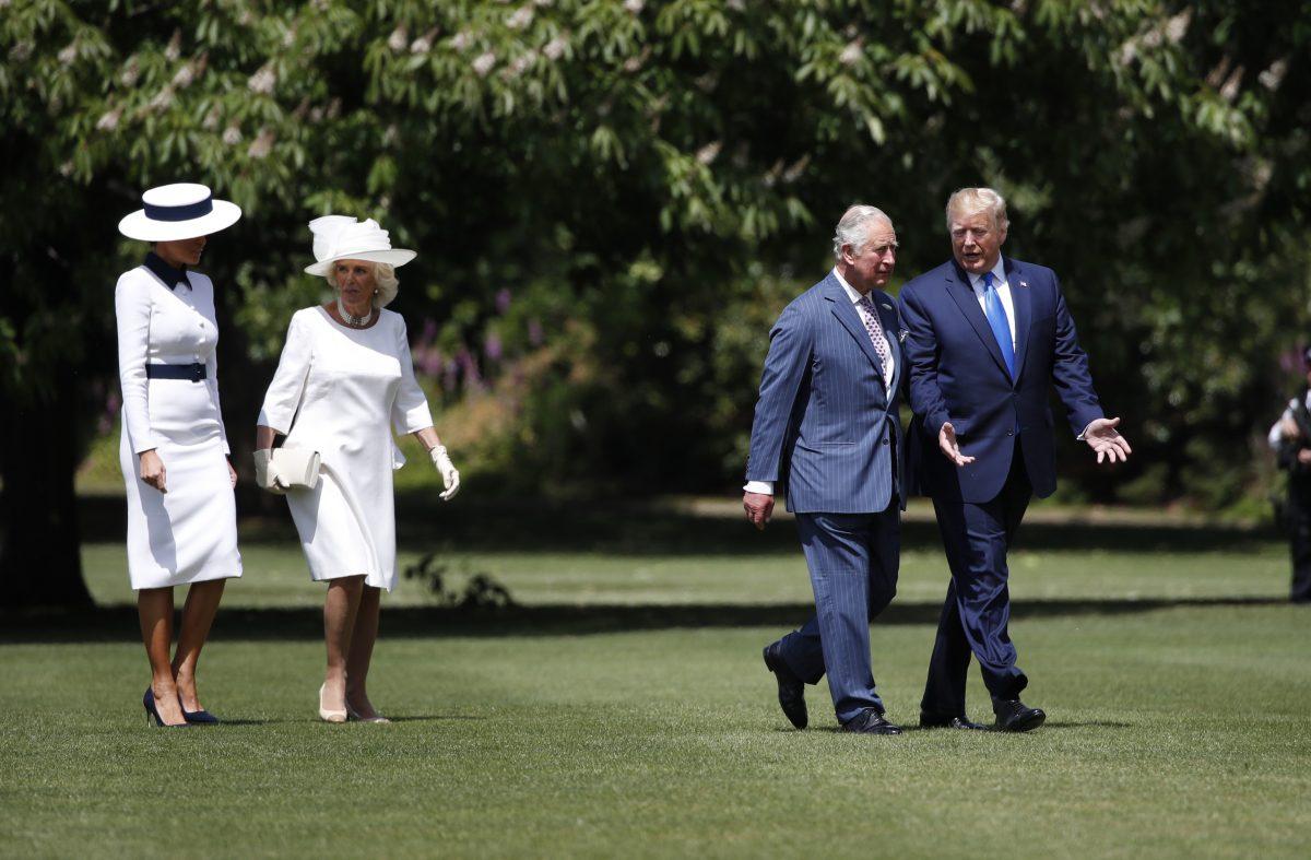President Donald Trump walks with Prince Charles and first lady Melania Trump walks with Camilla, the Duchess of Cornwall, after arriving at Buckingham Palace, Monday, June 3, 2019, in London. (AP Photo/Alex Brandon)
