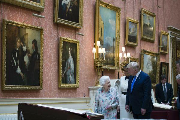 Queen Elizabeth II shows items in the Royal Gifts collection to first lady Melania Trump and President Donald Trump at Buckingham Palace, Monday, June 3, 2019, in London. (AP Photo/Alex Brandon)