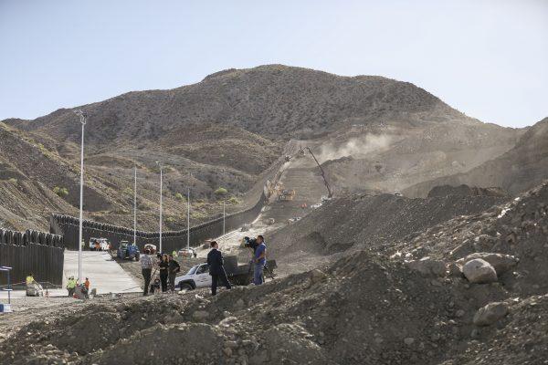 Construction continues up Mount Cristo Rey on the new half-mile section of border fence built by the We Build the Wall group at Sunland Park, N.M., on May 30, 2019. (Charlotte Cuthbertson/The Epoch Times)