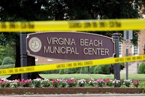 Police tape frames a sign at one of the entrances to the municipal government complex where a shooting incident occurred in Virginia Beach, Vir., U.S. on June 1, 2019. (Jonathan Drake/Reuters)