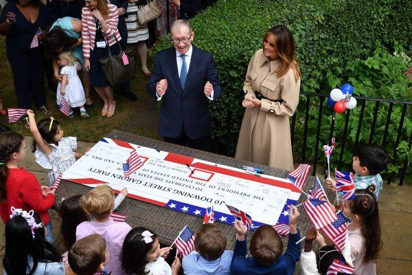 Philip May and First Lady Melania Trump attend a garden party for families of staff from No.10 and the US Embassy in London, at 10 Downing Street, during the second day of President Trump's State Visit in London, England on June 4, 2019. (Jeff J Mitchell/Getty Images)