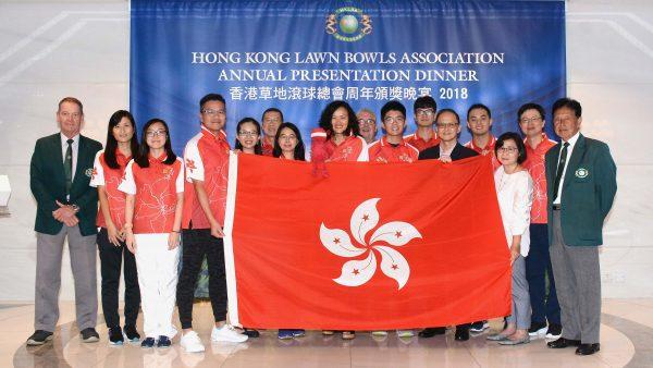 Bowler of the Year Tony Cheung (holding the flag on the left) receives the national flag for the Asia Pacific Championship from Kelvin Chan (fifth from right), of Leisure and Cultural Services Department at the HKLBA annual presentation dinner last Friday, May 31. (Stephanie Worth)