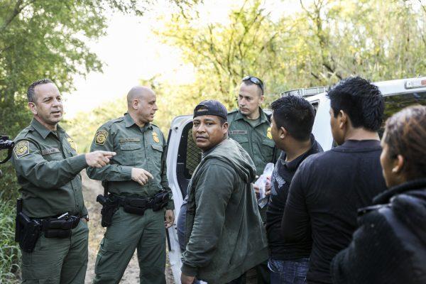 Border Patrol agents apprehend five illegal aliens from Mexico after they tried to run away after crossing the Rio Grande near McAllen, Texas, on April 18, 2019. (Charlotte Cuthbertson/The Epoch Times)