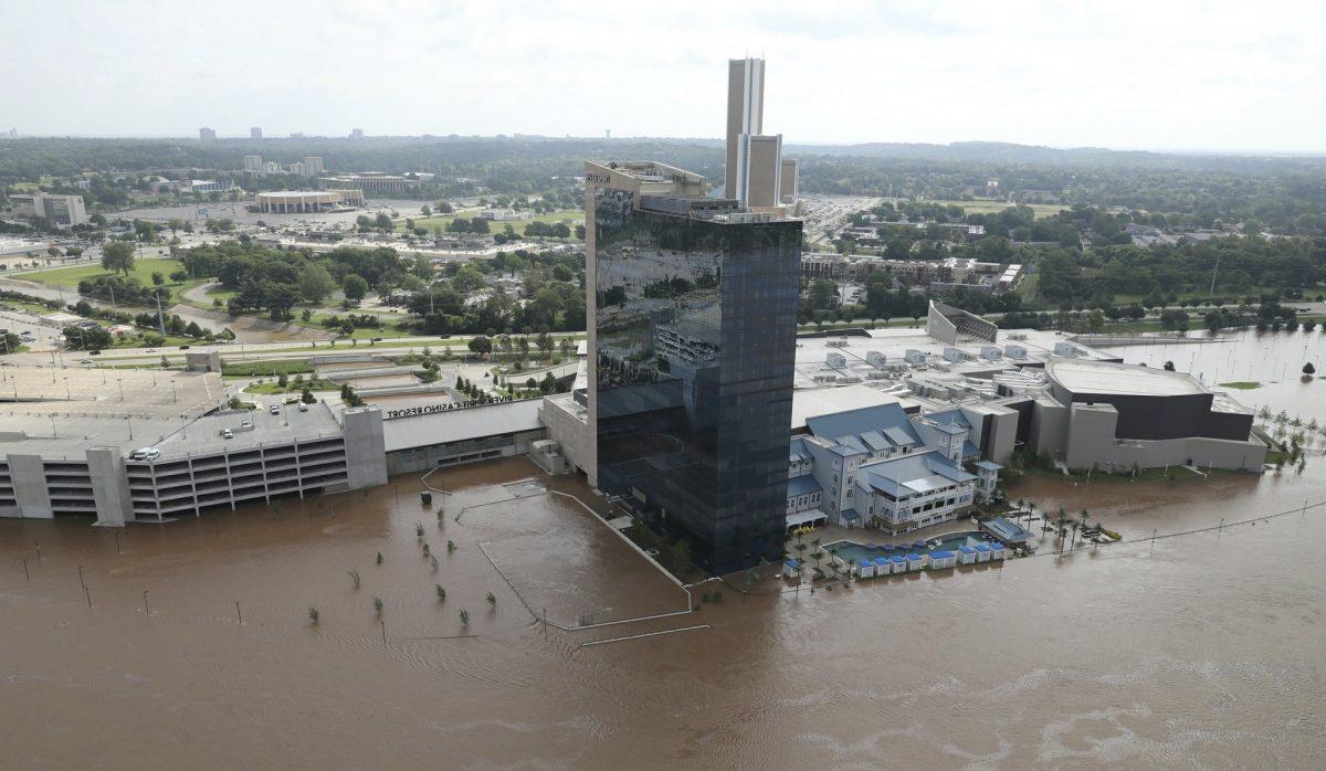 The River Spirit Hotel and Casino has flood waters surrounding it on the Arkansas River in Tulsa, Okla., on May 24, 2019. (Tom Gilbert/Tulsa World via AP)