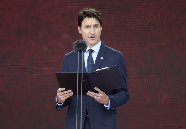 Canadian Prime Minister Justin Trudeau speaks during commemorations for the 75th Anniversary of the D-Day landings, in Portsmouth, England, on June 5, 2019. (Andrew Matthews/PA via AP/The Canadian Press)