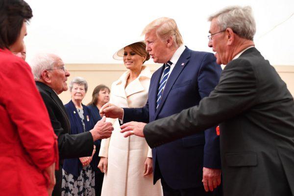 President of the United States, Donald Trump and First Lady of the United States, Melania Trump meet veterans during the D-day 75 Commemorations on June 05, 2019 in Portsmouth, England. The political heads of 16 countries involved in World War II joined Her Majesty, The Queen on the UK south coast for a service to commemorate the 75th anniversary of D-Day. Overnight it was announced that all 16 had signed an historic proclamation of peace to ensure the horrors of the Second World War are never repeated. (Jeff J Mitchell - WPA Pool /Getty Images)