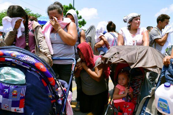 Migrants react after being detained during a joint operation by the Mexican government to stop a caravan of Central American migrants on their way to the United States, at Metapa de Dominguez, in Chiapas state, Mexico, on June 5, 2019. (Jose Torres/Reuters)