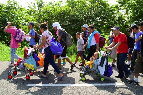 Migrants from Central America walk on a highway during their journey towards the United States, in Ciudad Hidalgo, Chiapas state, Mexico, on June 5, 2019. (Jose Torres/Reuters)