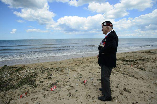 Veteran of the Second World War Roy Hare stands and looks out from Juno Beach following the D-Day 75th Anniversary Canadian National Commemorative Ceremony at Juno Beach in Courseulles-Sur-Mer, France on June 6, 2019. (Sean Kilpatrick/The Canadian Press)