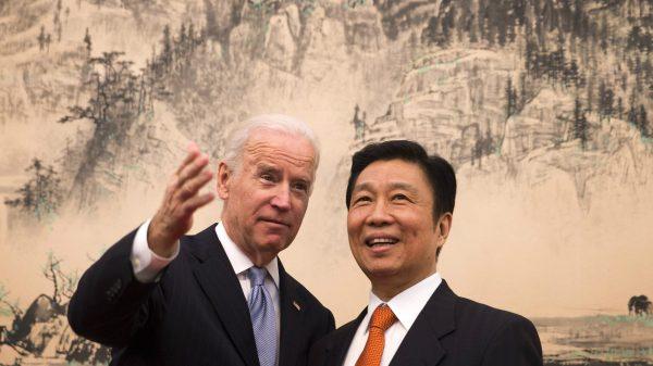 Then-Vice President Joe Biden (L) chats with Chinese Vice Chair Li Yuanchao in Beijing, China, on Dec. 5, 2013. (Andy Wong-Pool/Getty Images)