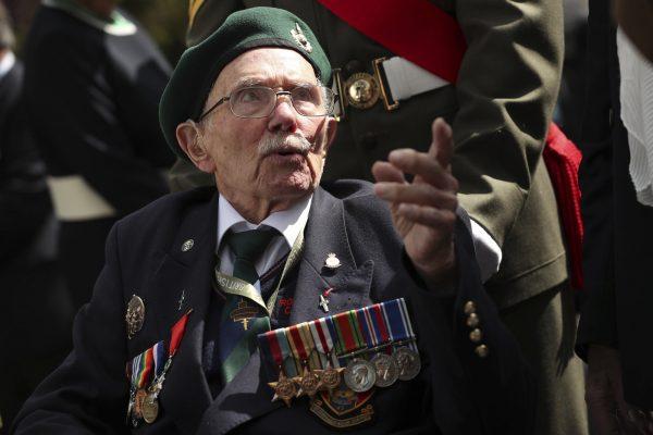 A World War II veteran arrives to the Bayeux War Cemetery for a ceremony to mark the 75th anniversary of D-Day in Bayeux, Normandy, France, on June 6, 2019. (Francisco Seco/Photo/AP)