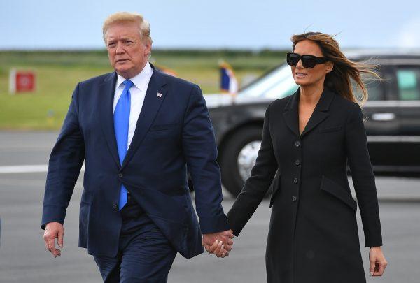 US President Donald Trump (L) and US First Lady Melania Trump walk on the tarmac on the way to board Air Force One before departing from the Caen-Carpiquet Airport in Carpiquet, Normandy, northwestern France, on June 6, 2019, after attending D-Day commemorations marking the 75th anniversary of the World War II Allied landings in Normandy. (Mandel Ngan/AFP/Getty Images)