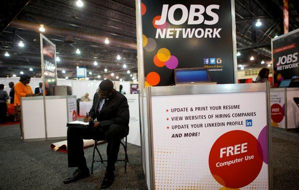 A job-seeker completes an application at a career job fair in Philadelphia, Pa., on July 25, 2013. (Mark Makela/File Photo via Reuters)