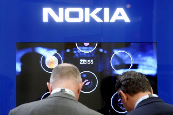 Visitors check products at the Nokia stand at the Mobile World Congress (MWC) in Barcelona on February 27, 2019. (JOSEP LAGO/AFP/Getty Images)