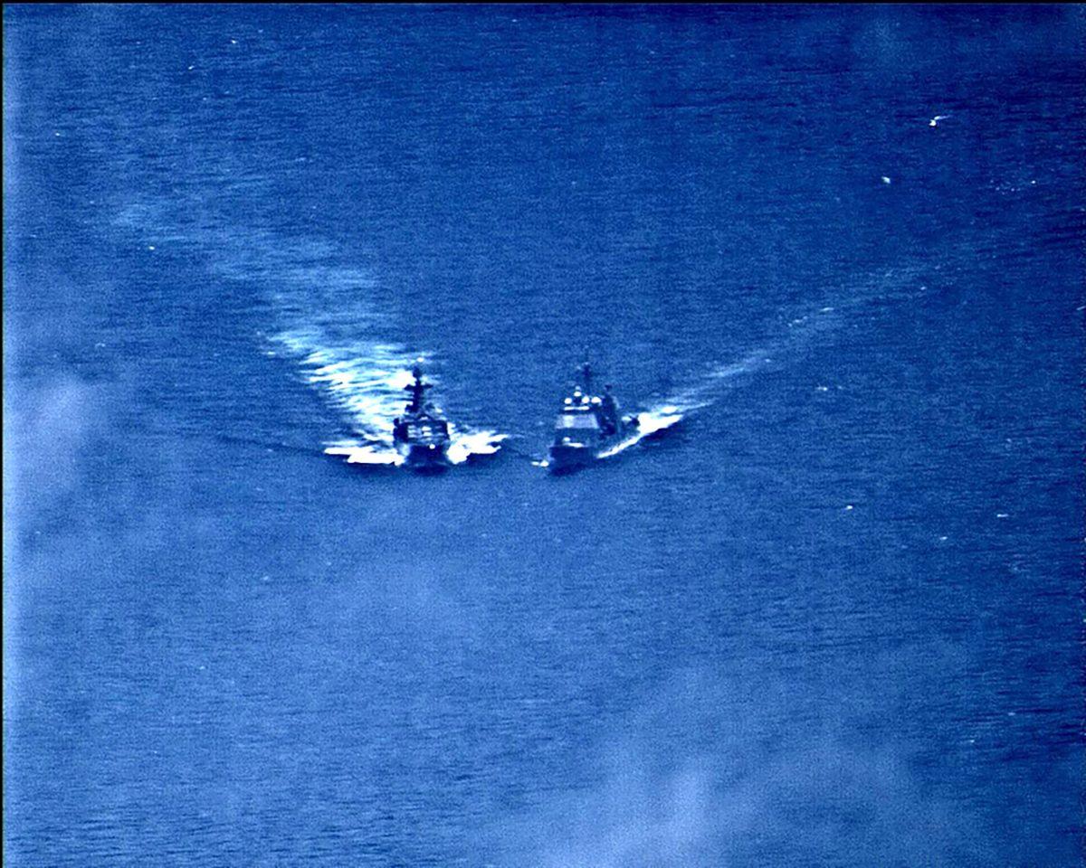 A surveillance photo shows the Russian naval destroyer Udaloy making what the U.S. Navy describes as an unsafe maneuver against the Ticonderoga-class guided-missile cruiser USS Chancellorsville in the Philippine Sea June 7, 2019. (U.S. Navy/Handout via Reuters)