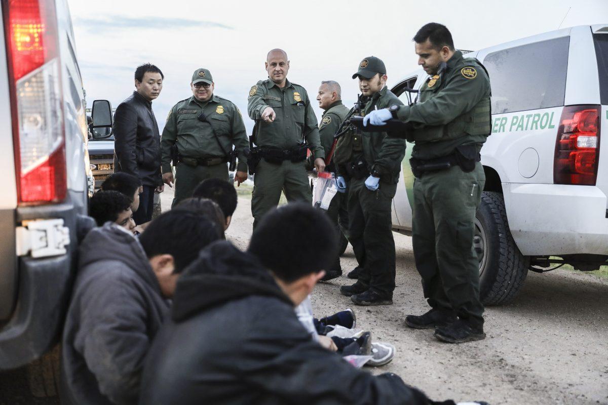 Border Patrol agents apprehend seven illegal immigrants from China, one from Mexico, and one from El Salvador after they tried to evade capture after crossing the Rio Grande from Mexico into the United States near McAllen, Texas, on April 18, 2019. (Charlotte Cuthbertson/The Epoch Times)