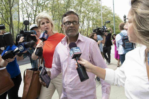 Ashiqul Alam 's father is surrounded by reporters as she leaves federal court in Brooklyn in New York on June 7, 2019. (Mary Altaffer/AP)