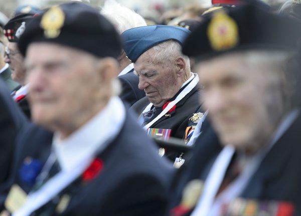 Veterans take part in the D-Day 75th Anniversary Canadian National Commemorative Ceremony at Juno Beach in Courseulles-Sur-Mer, France on June 6, 2019. (Sean Kilpatrick/The Canadian Press via AP)