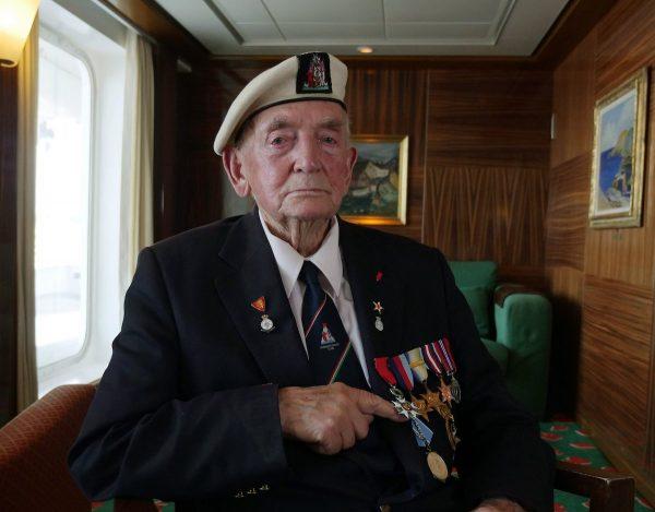 D-Day Veteran Donald Hitchcock poses for a photo wearing his campaign medals aboard the MV Boudicca ship as veterans return to the scene of the D-Day landings 75-years after the Allied invasion of northern France, on June 4, 2019. (AP Photo/Ben Jary)