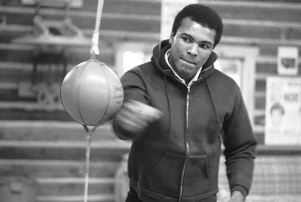 Muhammad Ali punches a bag in his Deer Lake, Pa., training camp where he was preparing for his rematch with Joe Frazier, on Jan.10 1974. (Rusty Kennedy/AP Photo)