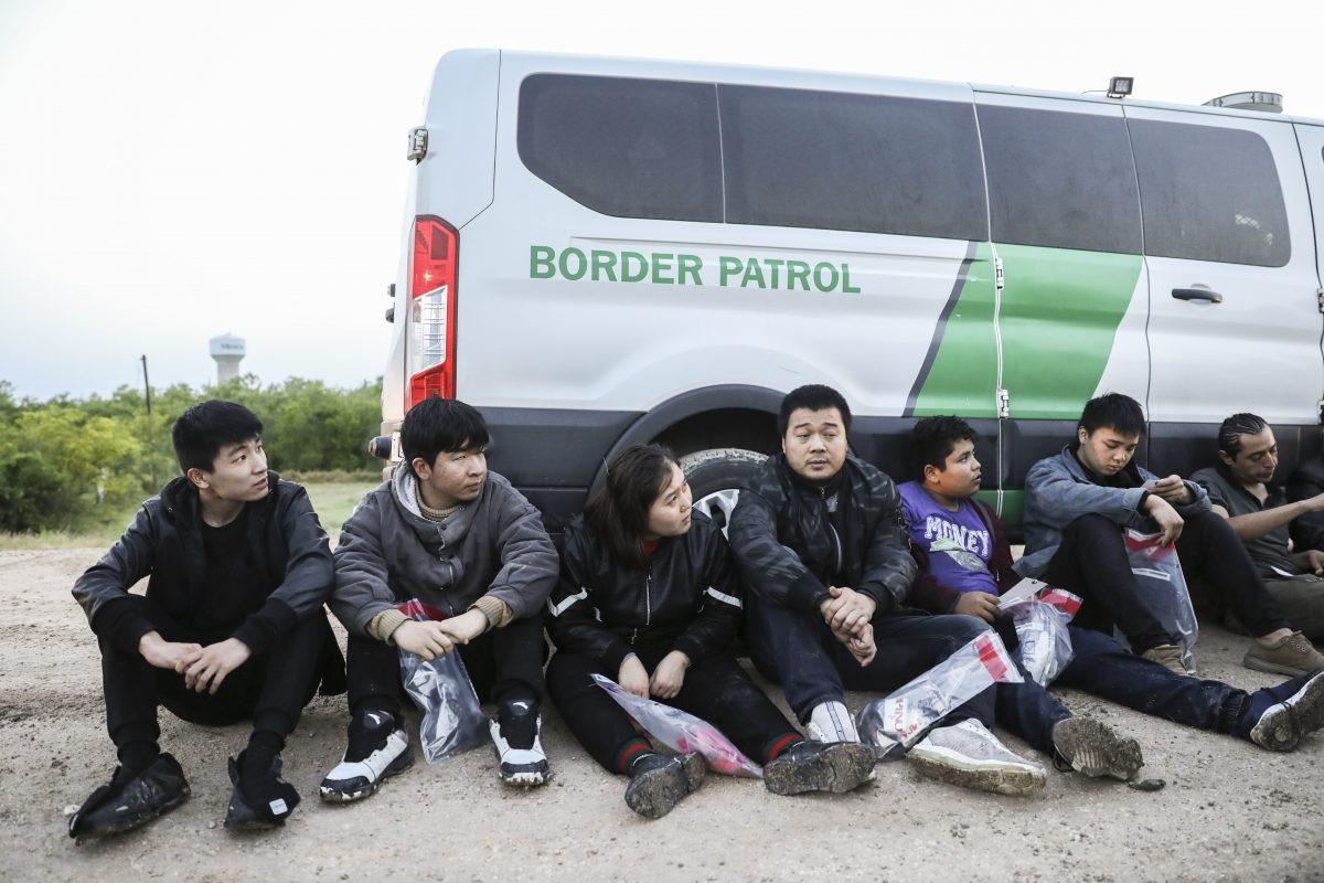 Border Patrol agents apprehend seven illegal immigrants from China, one from Mexico, and one from El Salvador after they tried to evade capture after crossing the Rio Grande from Mexico into the United States near McAllen, Texas, on April 18, 2019. (Charlotte Cuthbertson/The Epoch Times)