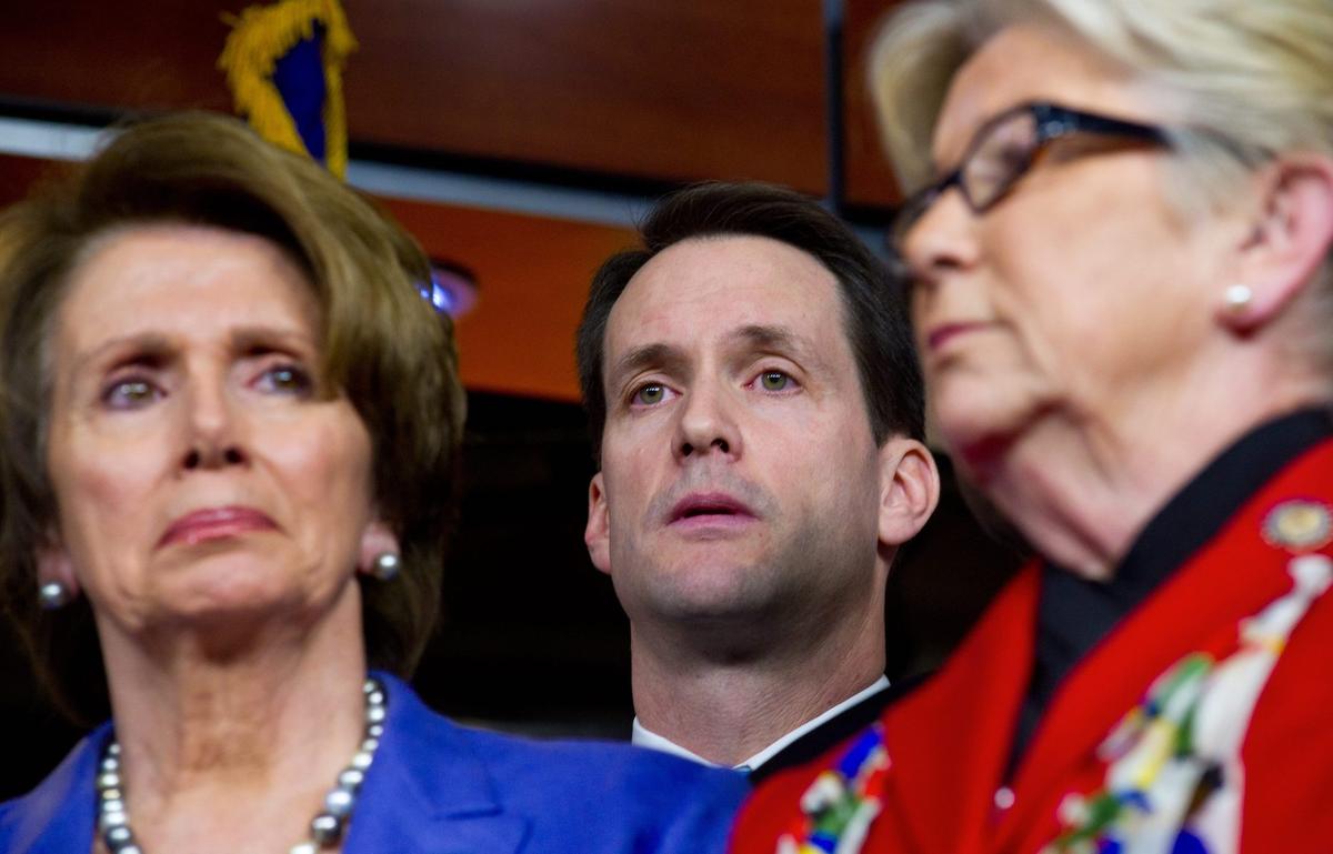 Rep. Jim Himes(C), (D-Conn.), behind Rep. Nancy Pelosi, (D-Calif.), and then-Rep. Carolyn McCarthy (D-N.Y.) after speaking to reporters on Capitol Hill in Washington, on Dec. 19, 2012. (Karen Bleier/AFP/Getty Images)
