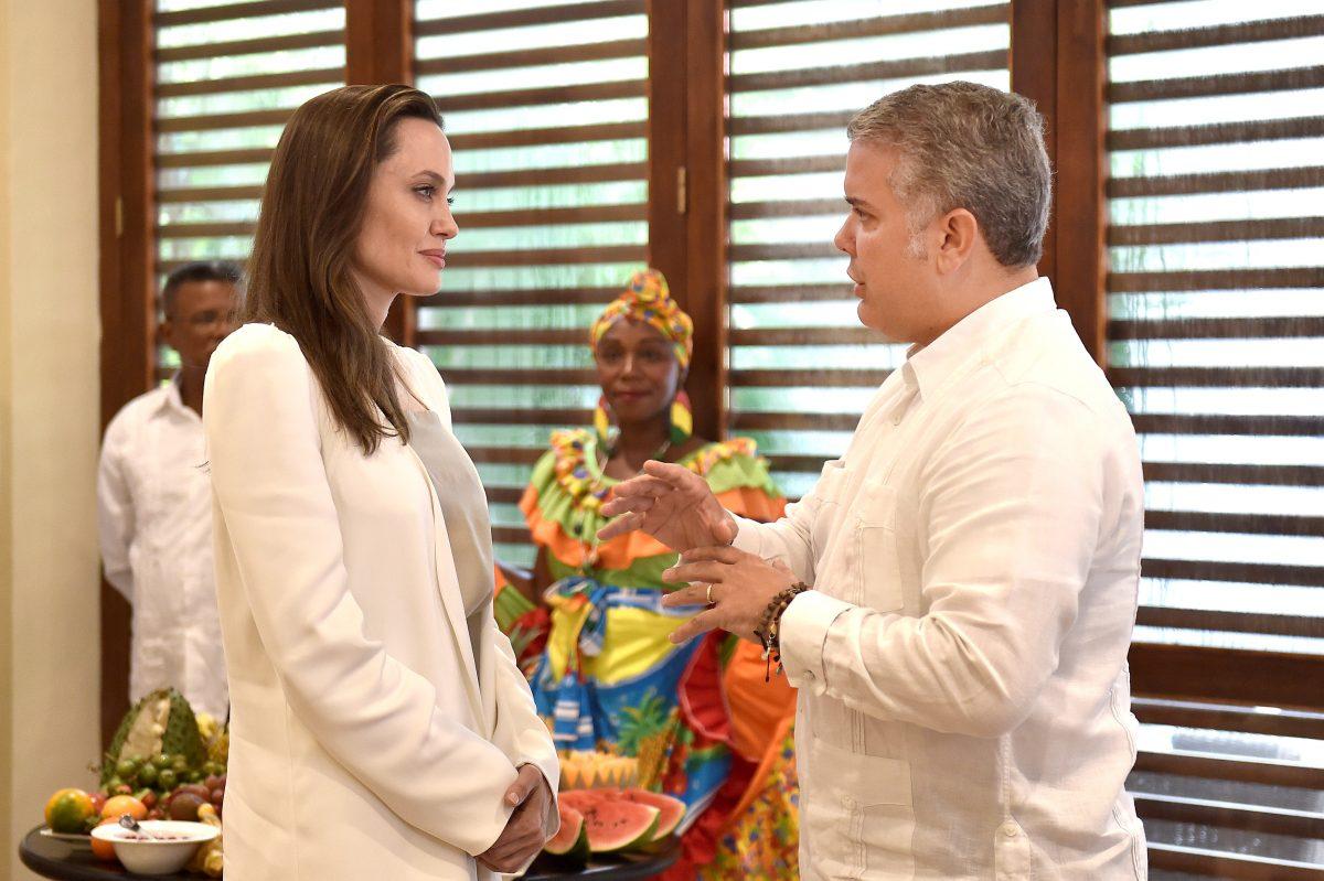 Special envoy for the United Nations High Commissioner for Refugees Angelina Jolie speaks with Colombia's President Ivan Duque Marquez, in Cartagena, Colombia on June 8, 2019. (Presidency/Handout via Reuters)