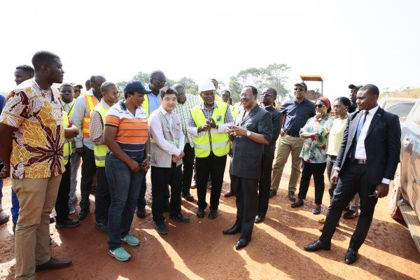 Officials of the Ministry of Public Works inspect a section of a road built by Chinese state-owned company Sinohydro. (Amindeh Blaise Atabong for The Epoch Times)