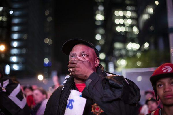 Raptors fans react outside of Scotiabank Arena after the Toronto Raptors lost Game 5 of the NBA Final to the Golden State Warriors in Toronto, on Monday, June 10, 2019. (Christopher Katsarov/The Canadian Press)