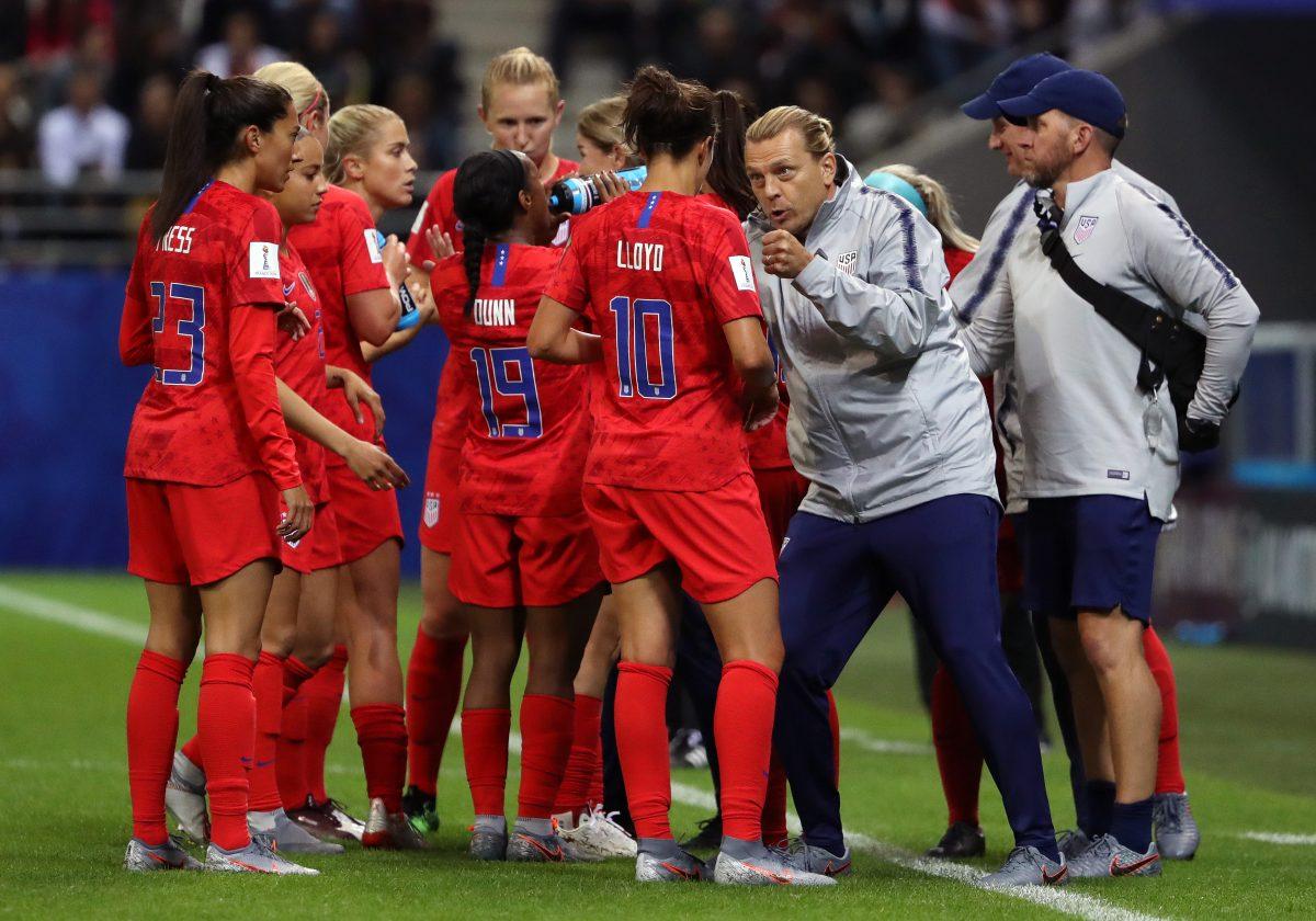 USA staff members speak to players of USA during the 2019 FIFA Women's World Cup France group F match between USA and Thailand at Stade Auguste Delaune in Reims, France on June 11, 2019. (Robert Cianflone/Getty Images)