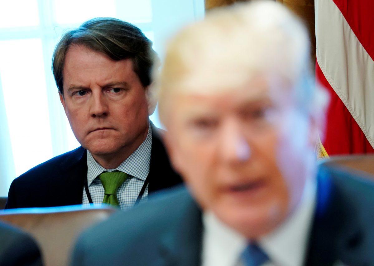 White House Counsel Don McGahn sits behind U.S. President Donald Trump as the president holds a cabinet meeting at the White House in Washington, U.S., on June 21, 2018. (Jonathan Ernst/Reuters)