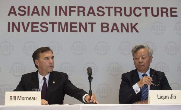 Canadian Minister of Finance Bill Morneau and president of the Asian Infrastructure Investment Bank Jin Liqun during a news conference at the Asian Infrastructure Investment Bank in Beijing, on Aug. 31, 2016. (The Canadian Press/Adrian Wyld)