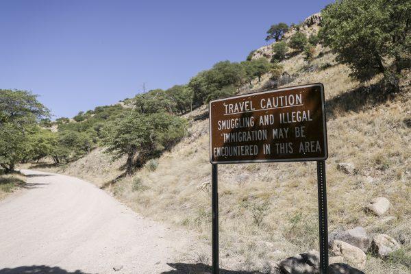 A sign in Carr Canyon warning of possible smuggling and illegal immigrants in the area, near the U.S.-Mexico border in Sierra Vista, Arizona, on May 5, 2019. (Charlotte Cuthbertson/The Epoch Times)