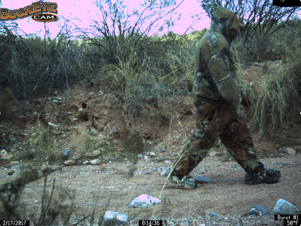 A motion-activated trail camera set by the Cochise County Sheriff's Office captures an illegal alien in camouflage clothing and carpet shoes on Feb. 17, 2017. (Courtesy of Cochise County Sheriff's Office)