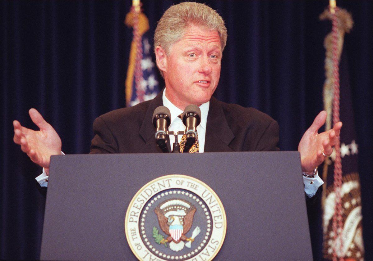 President Bill Clinton signed the Family and Medical Leave Act in 1993. Here he responds to questions at the White House on May 19, 1997. (Jamal Wilson/AFP/Getty Images)
