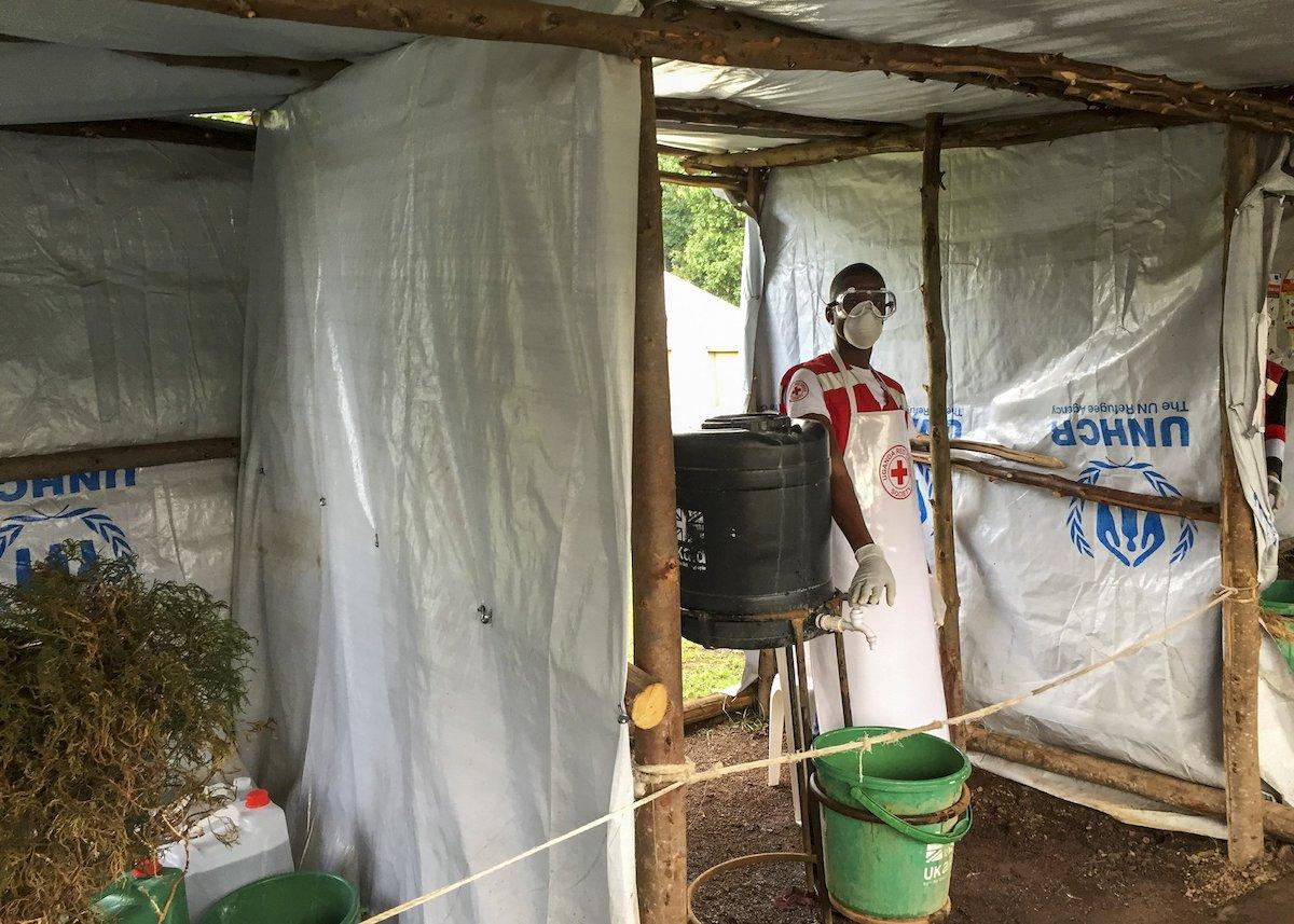 Ebola screening checkpoint where people crossing from Congo go through foot and hand washing with a chlorine solution and have their temperature taken, at the Bunagana border crossing with Congo, in western Uganda. On June 10, 2019. (Ben Wise/International Rescue Committee via AP)