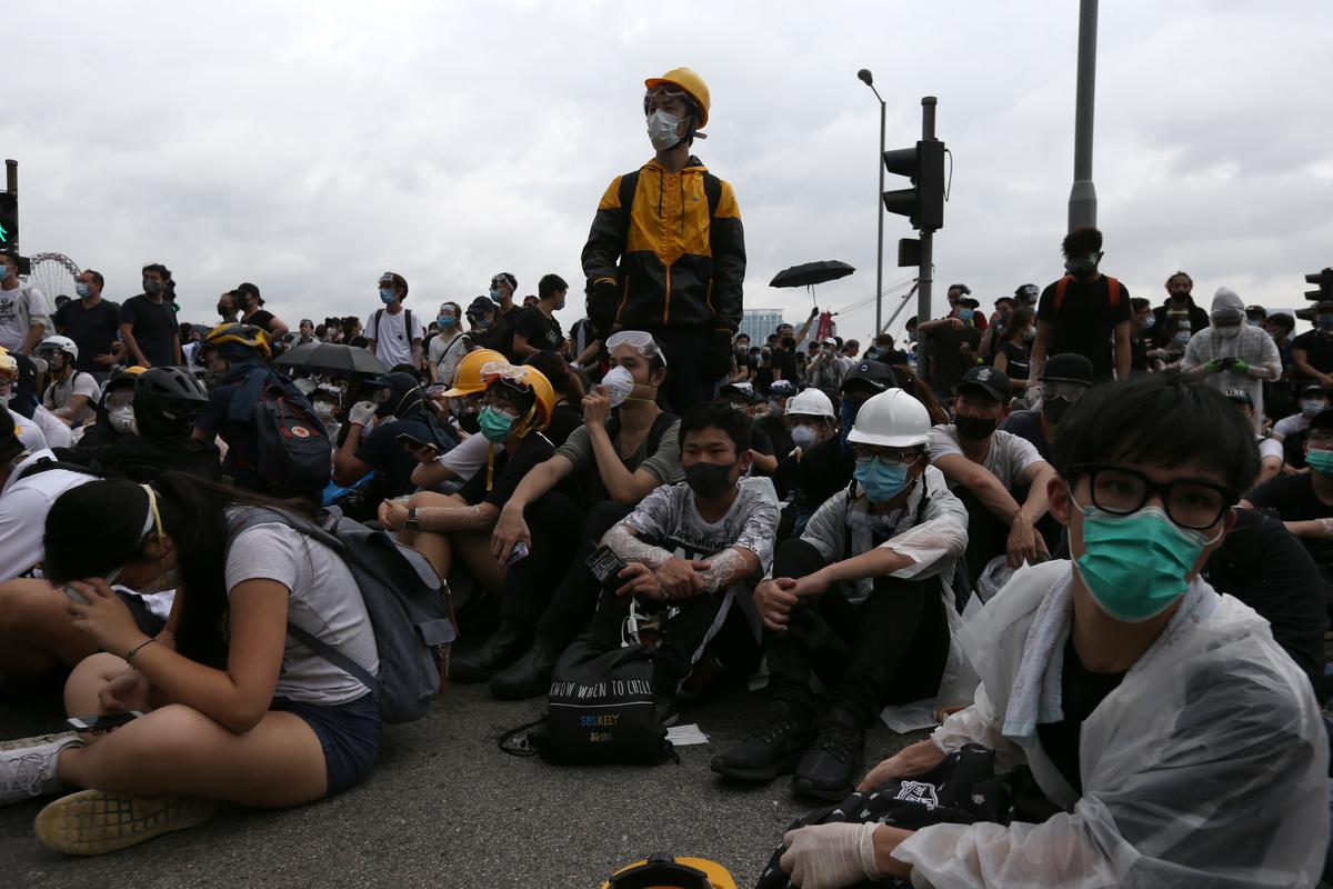 Protesters occupy a road as they demonstrate against a proposed extradition bill in Hong Kong, China Jun. 12, 2019. (Athit Perawongmetha/Reuters)