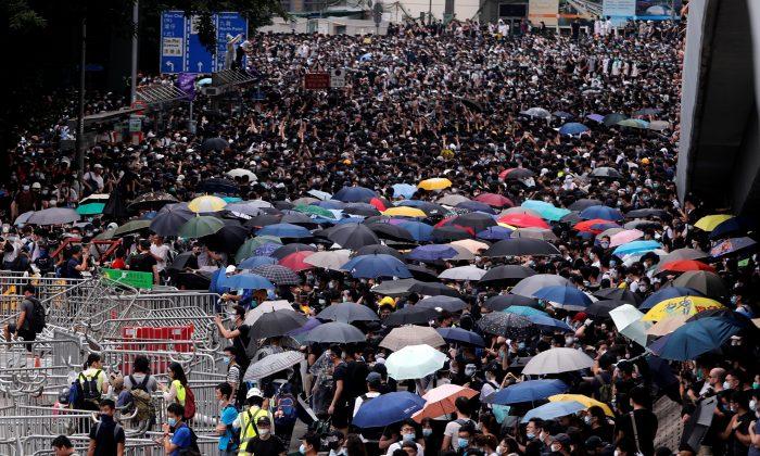 Thousands of Protesters Paralyze Hong Kong’s Financial Hub Over Extradition Bill