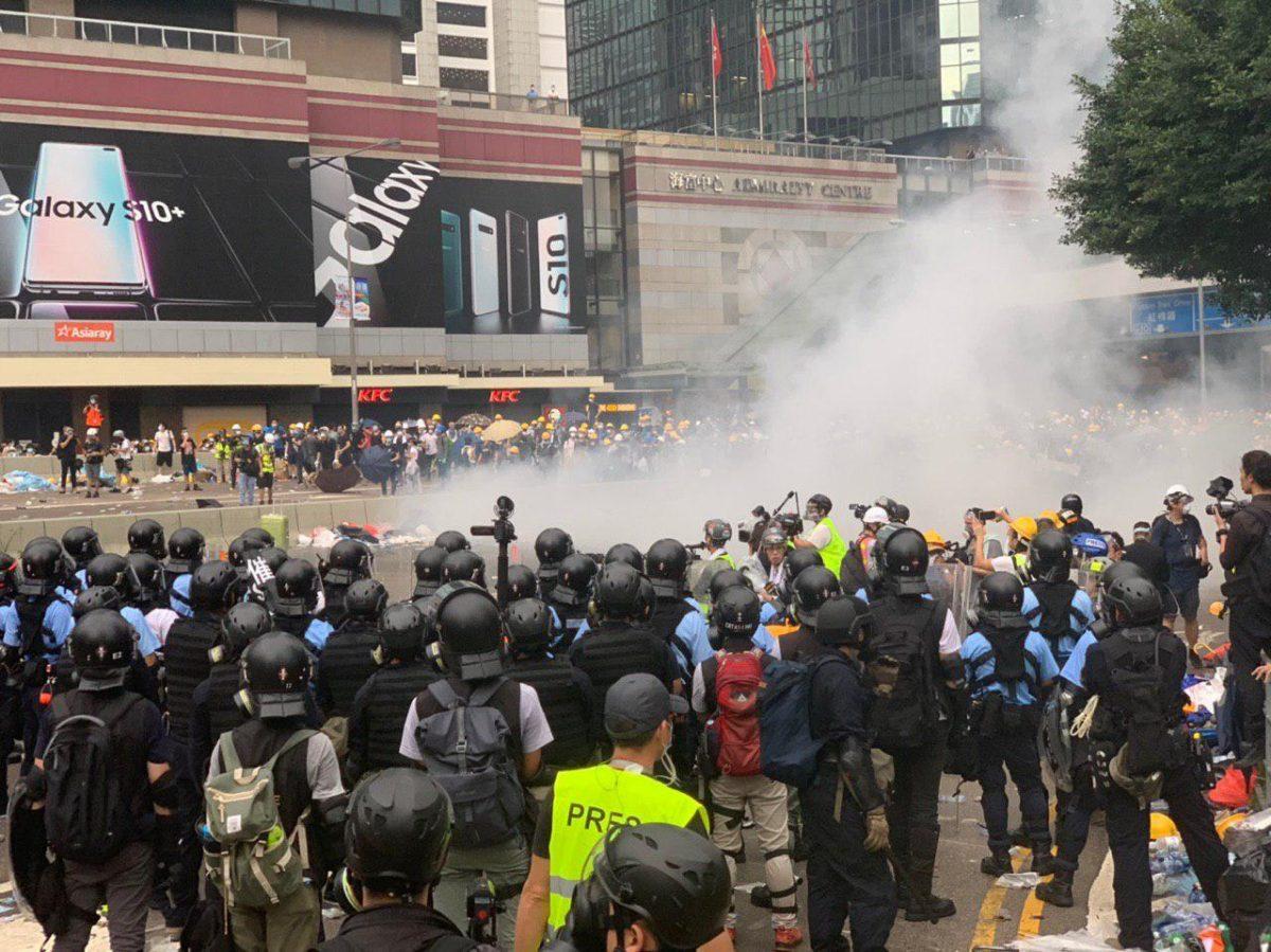 Police fired tear gas toward the protesters at the Admiralty Centre in Hong Kong, on June 12, 2019. (Li Yi/The Epoch Times)