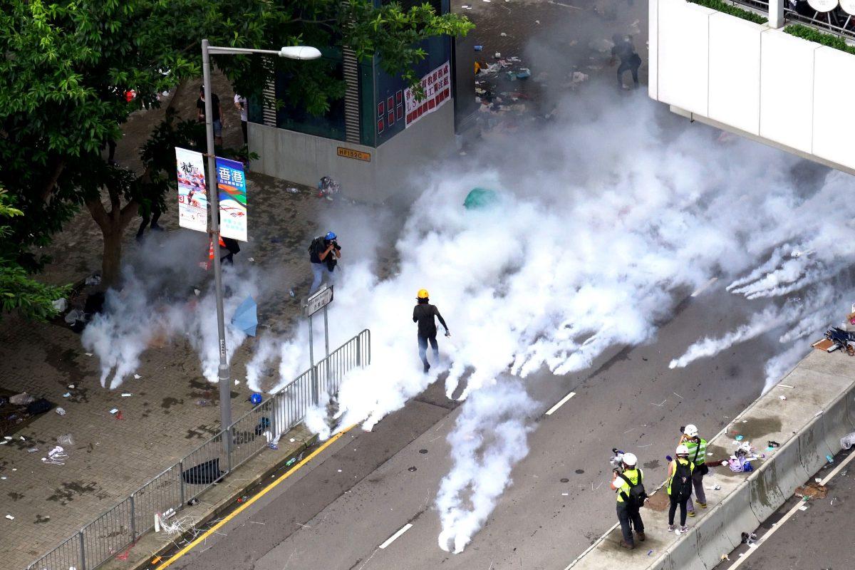 Police fired off tear gas on Tim Mei Avenue in Hong Kong on June 12, 2019. (Li Yi/The Epoch Times)