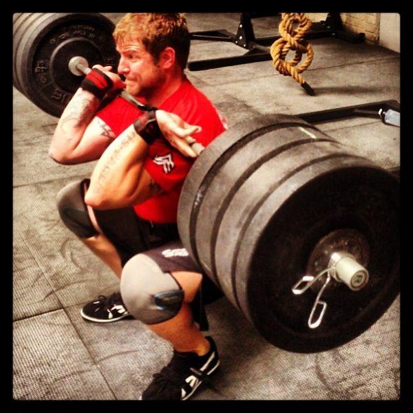 Adam Smith lifting weights. In 2016, he nearly committed suicide. (Courtesy of Adam Smith)