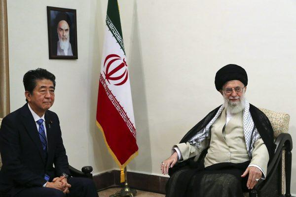 In this picture released by an official website of the office of the Iranian supreme leader, Supreme Leader Ayatollah Ali Khamenei, right, meets with Japanese Prime Minister Shinzo Abe, in Tehran, Iran on June 13, 2019. (Office of the Iranian Supreme Leader via AP)