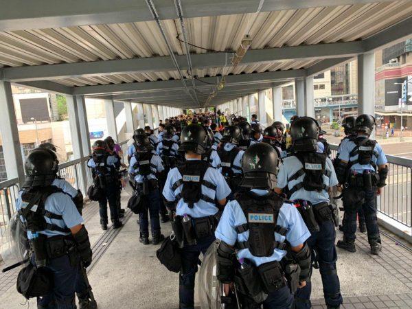 Police officers in riot gear at the Citic Bridge in Hong Kong on June 13, 2019. (Li Yi/The Epoch Times)